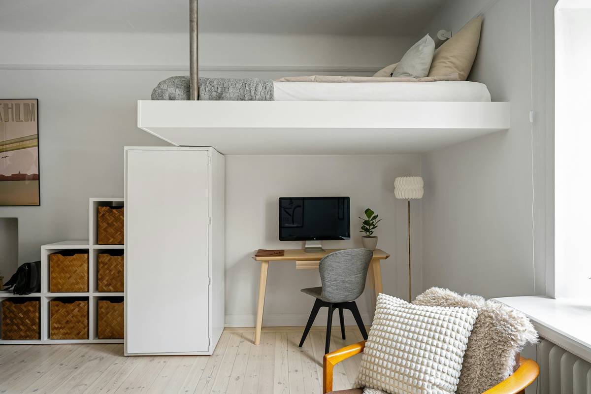 Before and after of a 420 sq ft Brooklyn studio with Ori smart bed and desk system—day mode shows clean workspace, night mode shows lowered bed with ambient lighting