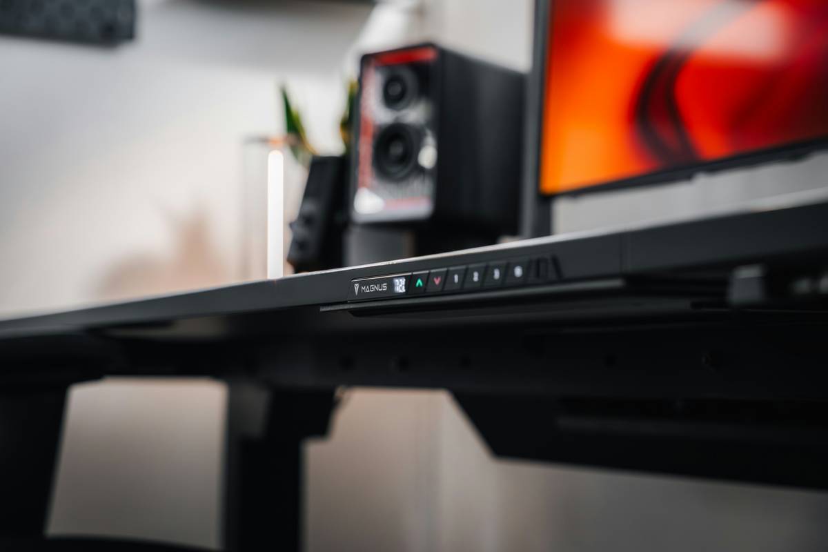 Close-up of foldable smart table with wireless charging pad and USB ports
